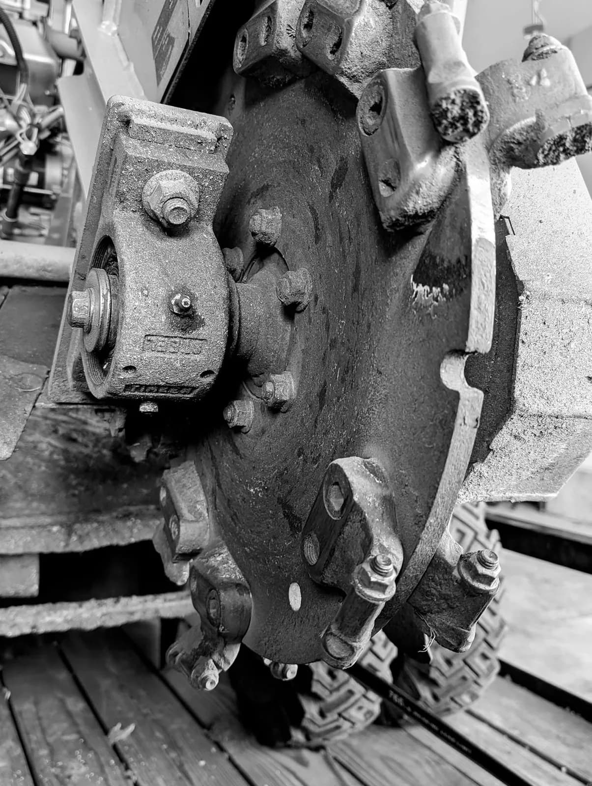 Close-up of the teeth around a stump grinder’s cutting wheel